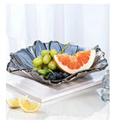 Ljojo Melon Seed & Fruit Plate Set on Crystal Glass Coffee Table