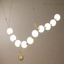 Ljojo Luxury Pendant Light: Necklace Shape Chandelier with White Glass Ball